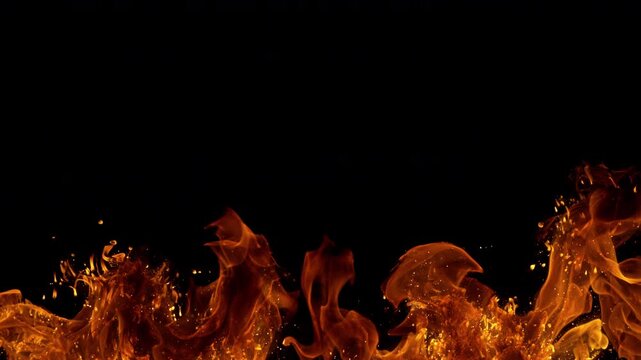 Super Slow Motion Shot of Real Big Fire Flames with Sparks Isolated on Black at 1000fps.