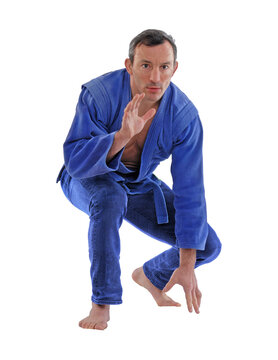 Martial arts fighter wearing blue kimono isolated on transparent layered background.