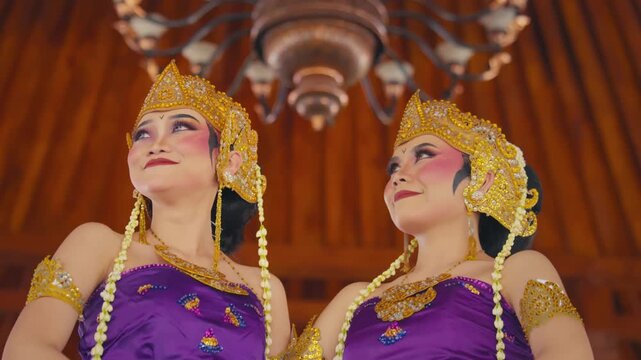 Cinematic Portrait of Two Dancers Gazing Upwards in Traditional Attire