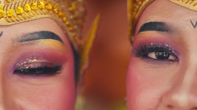 Macro Shot of Two Dancers' Eyes with Traditional Makeup