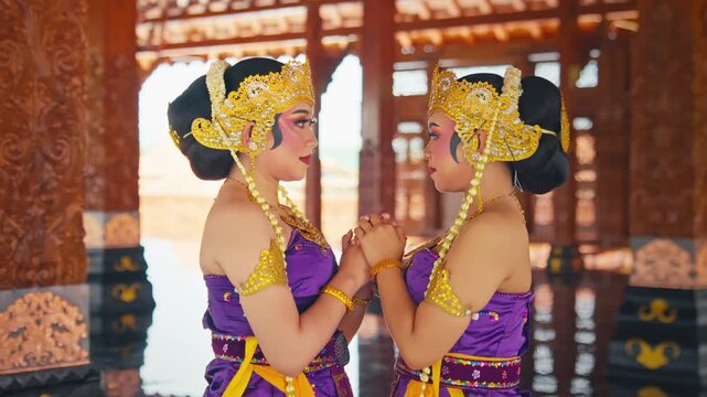 Wide Shot of Two Dancers Holding Hands in Traditional Wooden Hall