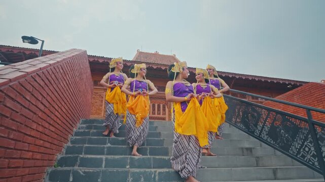 Group of Javanese Dancers Posing on Outdoor Staircase