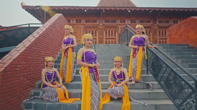 Full Group of Javanese Dancers Posing on Grand Outdoor Staircase