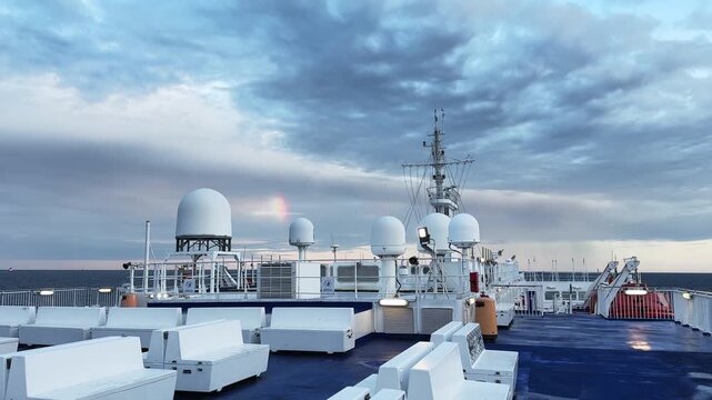 Cruiseferry upper deck with mast and other equipment at morning