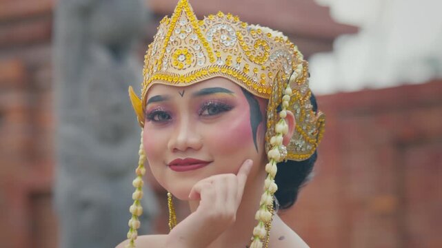 Pensive Javanese Dancer Resting Chin on Hand in Close Up