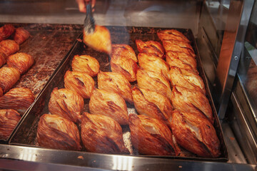 Obraz premium Traditional Maltese pastizzi pastry displayed in a bakery display case on Gozo island.
