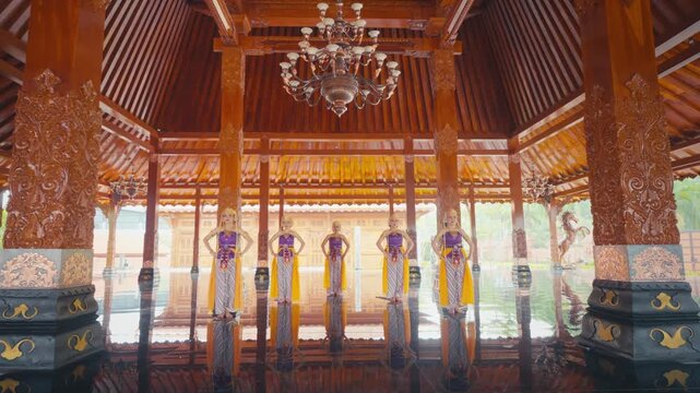 Front View of Five Dancers in Traditional Javanese Attire Standing in Hall