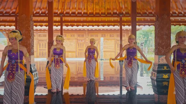 Wide Shot of Traditional Dancers Performing in Line on Reflective Floor