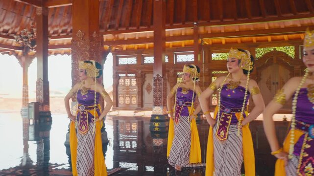Dynamic Shot of Javanese Dancers Moving Sashes in Unison