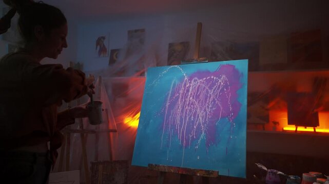 Creative Process Captured As Artist Employs Bold Neon Hues With Dynamic Gestures During Night Hours