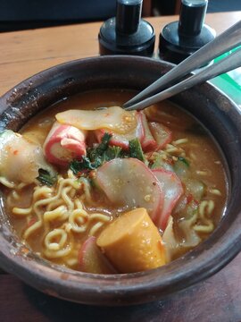 Indonesian Street Food Spicy Seblak with Noodles, Sausage, and Crackers