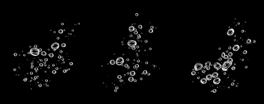Transparent air bubbles floating in three clusters against a black background, creating a clean aquatic texture for water effects, beverage designs, underwater scenes, overlays, creative compositions.