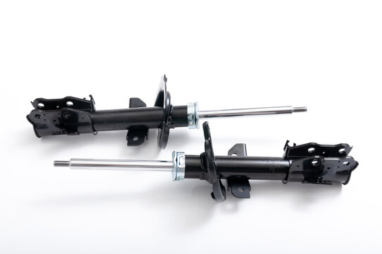 Black front shock absorbers for car.