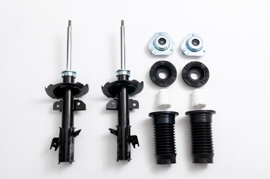 Set of new car front shock absorbers and accessories.