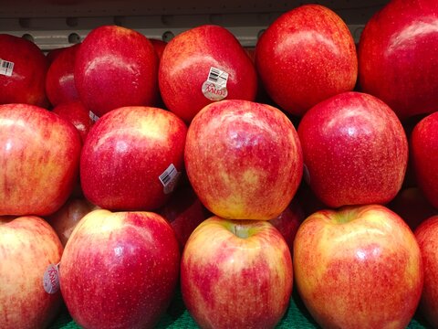 Surabaya, Jawa Timur, Indonesia - 25 June 2024: A pile of red apples. Fresh apples stacked together. Close-up.