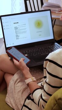Woman Reviewing Resume Before Submitting Job Application Using Mobile and Laptop App