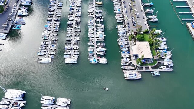 Top down aerial drone view of boats and yachts moored at Ala Wai Boat Harbor in Honolulu Hawaii