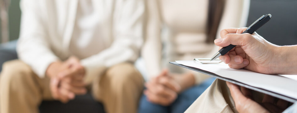 Psychology, depression asian young couple love woman and male patient consulting problem mental health with psychologist, psychiatrist at clinic together, wife encouraging husband, therapy health care