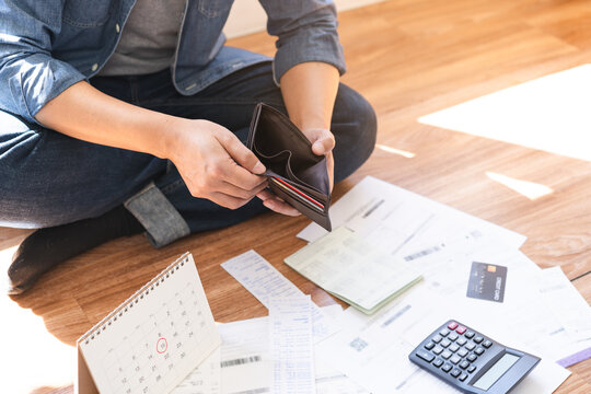 Stressed, Problem people asian woman hand holding and open an empty wallet not have money, credit card, not to payment bill, loan or expense in pay. Bankruptcy, bankrupt and debt financial concept.