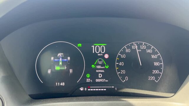 Car Dashboard Showing Speedometer and Hybrid System Status While Driving. 4k video