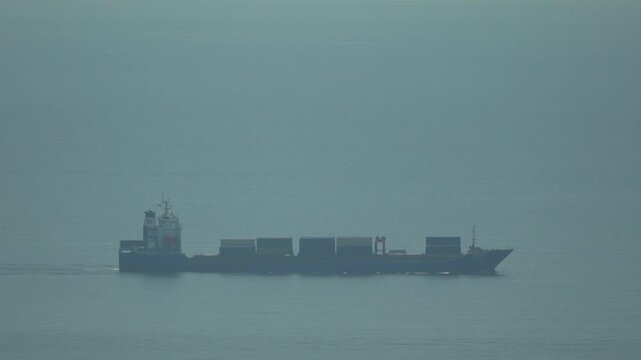 Container ship cargo ocean, large vessel transporting goods across calm sea