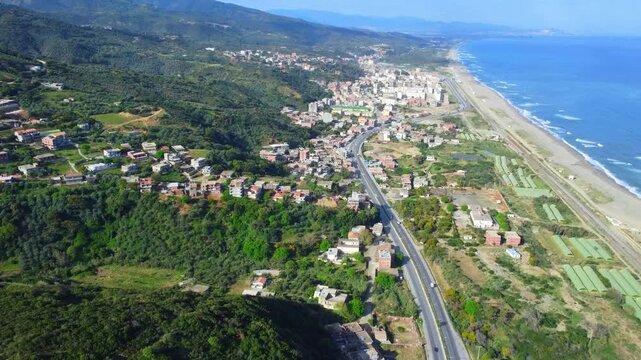 Small village with morning in state of Jijel, Algeria, rural village, A beautiful Mediterranean village in North Africa, Algeria from above, A small town overlooking the Mediterranean sea.
