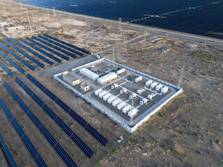 solar power station with battery energy storage in desert landscape © zhu difeng