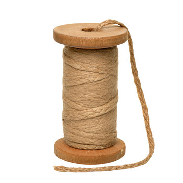 A rustic brown fiber cord wrapped around a classic timber bobbin provides a textured element for DIY projects and sustainable packaging designs