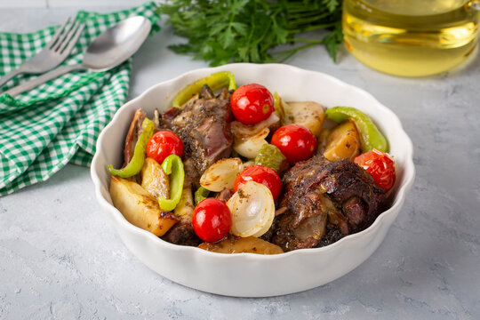 Baked lamb shank with vegetables. Turkish name; firinda kuzu incik