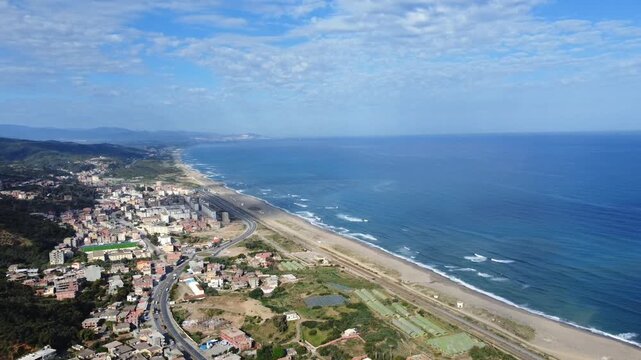 Small village with morning in state of Jijel, Algeria, rural village, A beautiful Mediterranean village in North Africa, Algeria from above, A small town overlooking the Mediterranean sea.