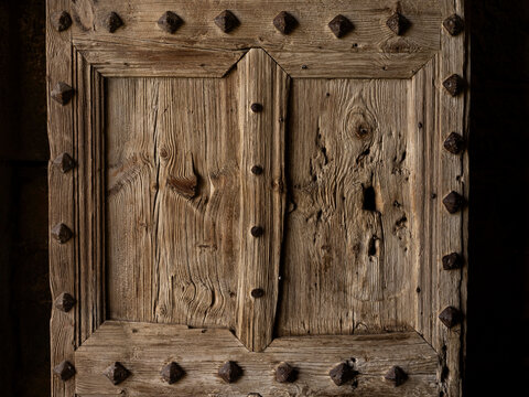 Wooden door in ancient church, Huesca, Spain