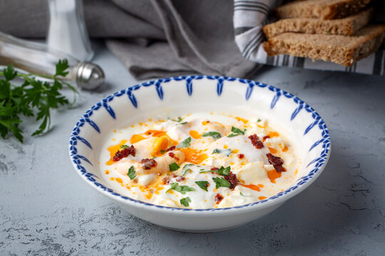 Cilbir, also called "Turkish Eggs", is a dish served as mezze: poached eggs topped over herbed greek yogurt, then drizzled with hot spiced paprika olive oil.