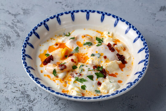 Cilbir, also called "Turkish Eggs", is a dish served as mezze: poached eggs topped over herbed greek yogurt, then drizzled with hot spiced paprika olive oil.