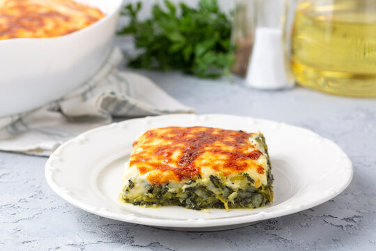 Baked Spinach with cheese delicious Italian food cuisine. Spinach gratin.