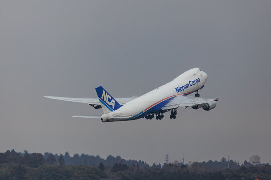 Nippon Cargo Airlines NCA Boeing 747-8F ascending at high altitude on January 25, 2025 at Narita Airport, Japan