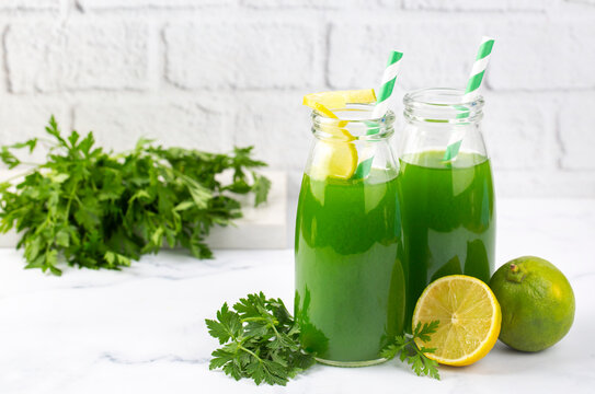 Green healthy detox, lemon and parsley juice. Green vegetable smoothie