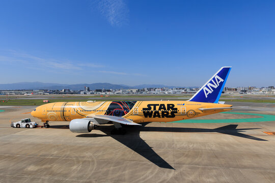 ANA Boeing 777-200ER in Star Wars C-3PO livery rolling out on runway on April 26 2025 at Fukuoka Airport Japan