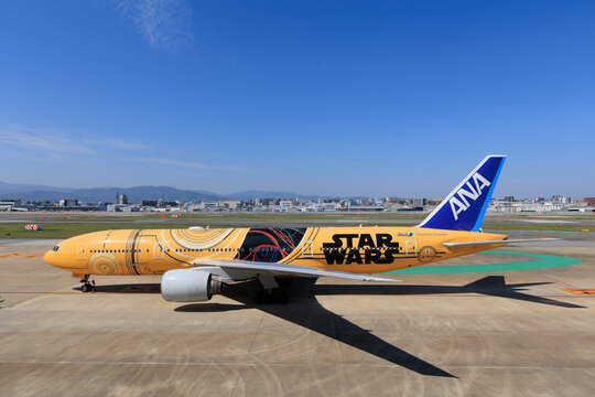 ANA Boeing 777-200ER in Star Wars C-3PO livery side view decelerating on April 26 2025 at Fukuoka Airport Japan
