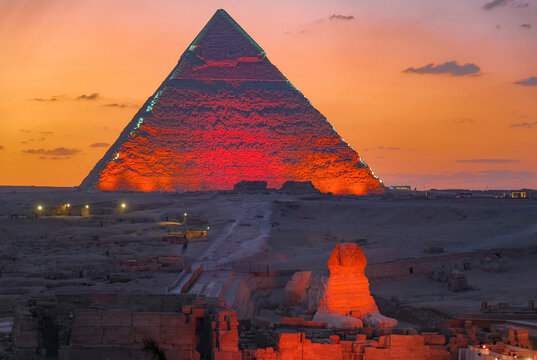 The great Sphinx and pyramid illuminated at sunset, Giza near Cairo, Egypt