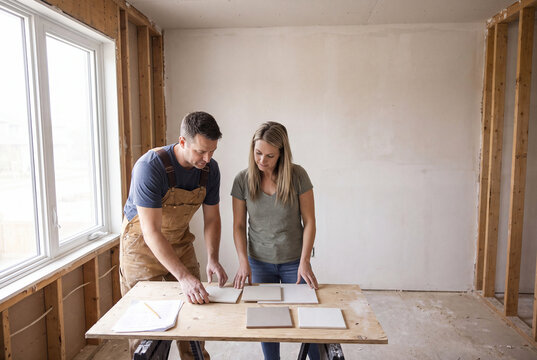 People choosing ceramic floor tiles for home renovation