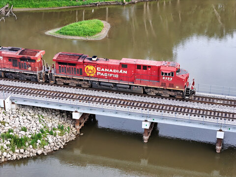 Savanna, Illinois August 16, 2026 Canadian Pacific 8133 Locomotive &mdash; GE ES44AC Freight Engine on Midwest Mainline crossing a bridge.