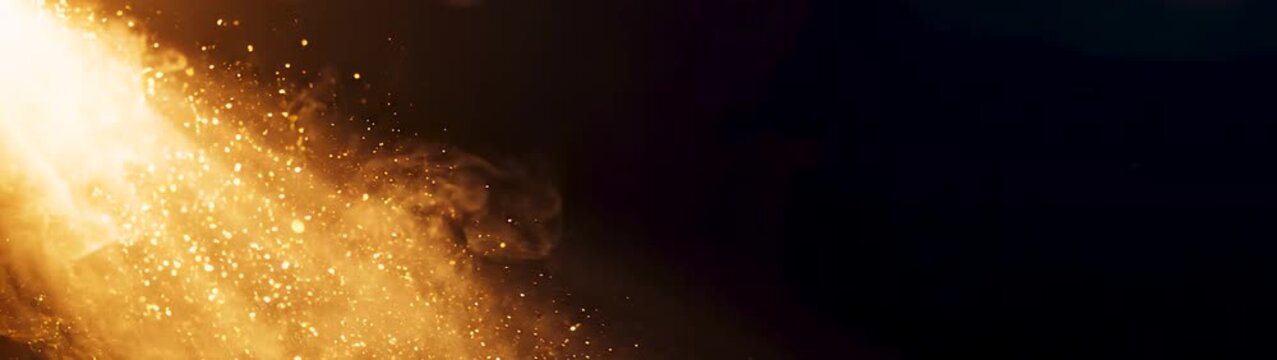 Fire hazard and emergency concept intense flames and glowing embers burning in darkness slow motion cinematic close up of fire particles and heat.