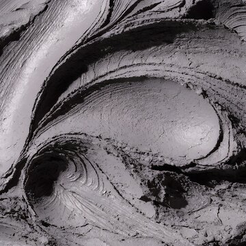 Macro photography of dark organic thermal mud texture