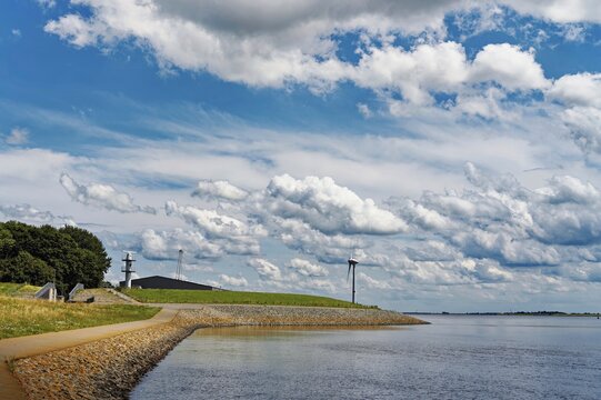 Footpath along the banks of the river Ems near Emden, East Frisia, Lower Saxony, Germany