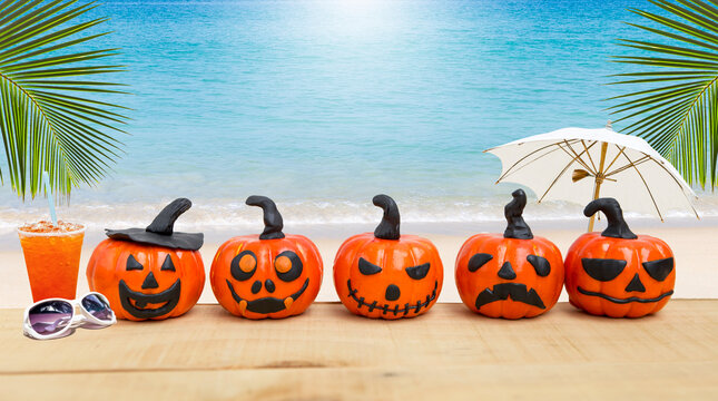Halloween pumpkins on tropical beach background, Halloween card background idea