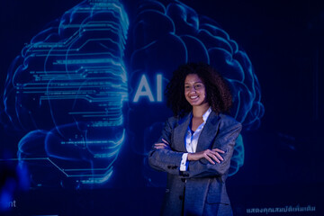 Professional woman stands confidently in front of a large digital display of a brain labeled with AI concepts during a tech event © Freeday photo