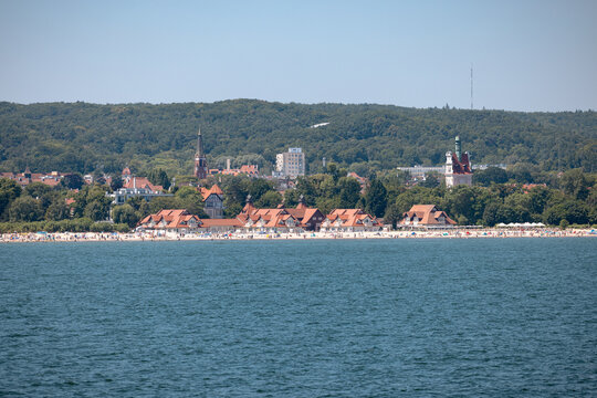 Sopot, Poland - July 16, 2026: Baltic seaside resort of Sopot stretches along the Bay of Gdańsk with beaches, waterfront buildings and sailboats offshore.