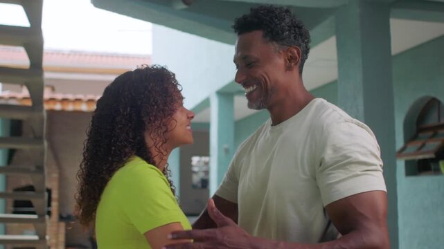 Man embracing teenage daughter with warm smile, expressing joy, affection, and emotional connection in heartfelt hug, intimate and genuine moment of love and family bonding