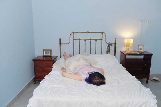 Non-binary person wearing a cute look lying in bed