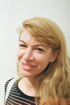 Smiling blonde woman in striped top